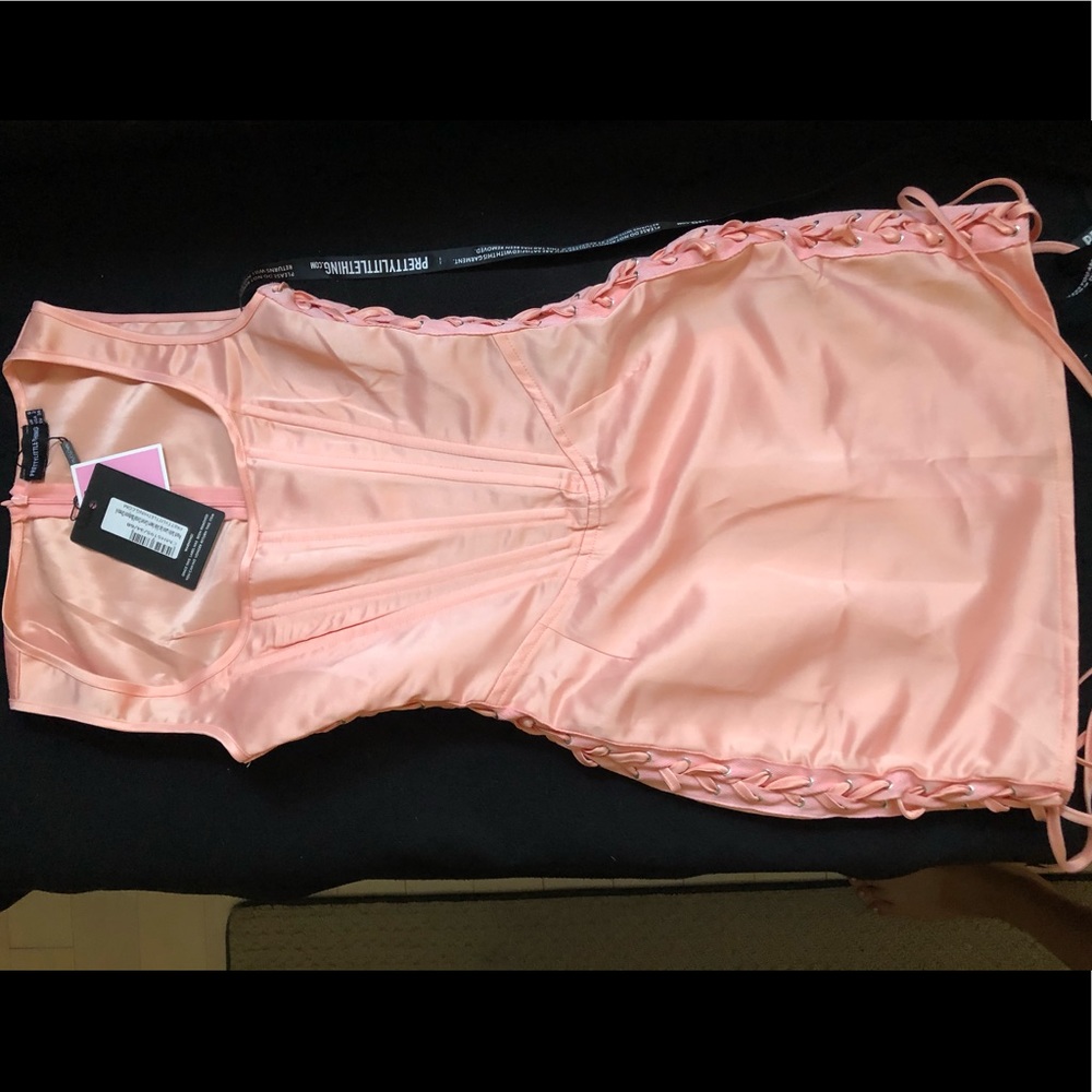 PRETTY LITTLE THING- Peach Satin Lace Up Dress